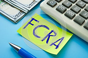 Business concept meaning FCRA Fair Credit Reporting ActÂ  with sign on the sheet